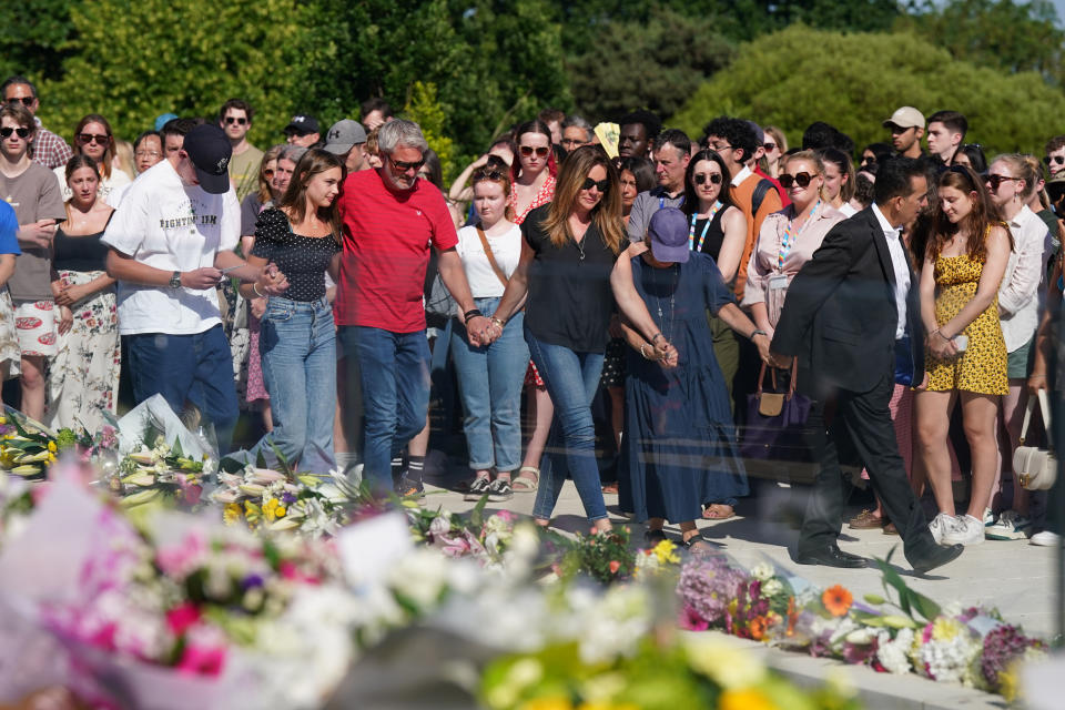 The families of Grace O'Malley-Kumar and Barnaby Webber attend a vigil at the University of Nottingham after they were killed. (Getty)