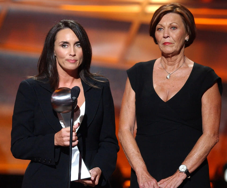 <p>Brett Favre’s wife Deanna with his mother Bonita accept his award on his behalf for the Best Moment (Photo by Michael Caulfield/WireImage for ESPN)</p>