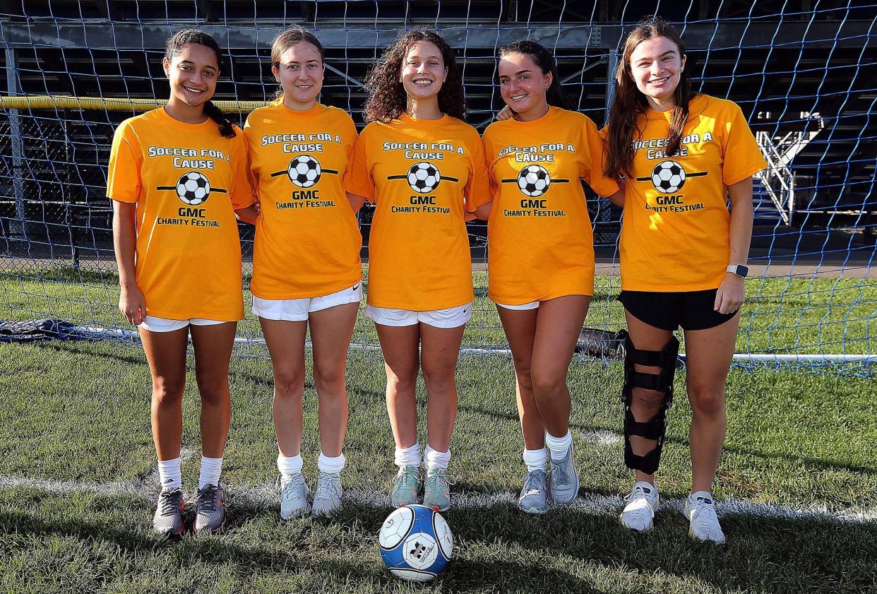 Metuchen High School girls soccer team members sporting their GMC Soccer for a Cause Charity Festival shirts.