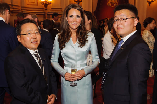 Catherine, Duchess of Cambridge poses with President of Mongolia Elbegdorj Tsakhia (L) during a reception at Buckingham Palace a reception for Heads of State and Government attending the Olympics Opening Ceremony on July 27, 2012 in London, England. (Photo by Dominic Lipinski - WPA Pool/Getty Images)