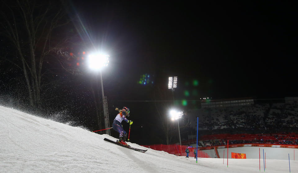 Gold medal winner Mikaela Shiffrin skis past a gate in the women's slalom at the Sochi 2014 Winter Olympics, Friday, Feb. 21, 2014, in Krasnaya Polyana, Russia. (AP Photo/Alessandro Trovati)