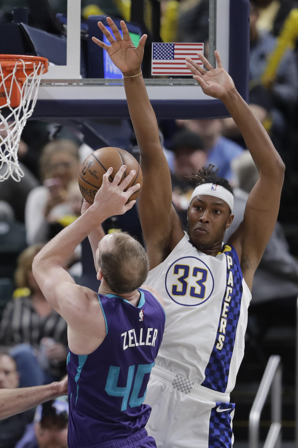 Charlotte Hornets' Cody Zeller (40) shoots against Indiana Pacers' Myles Turner (33) during the second half of an NBA basketball game, Sunday, Dec. 15, 2019, in Indianapolis. (AP Photo/Darron Cummings)