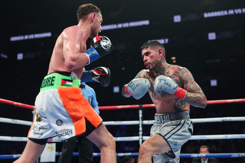 Sean McComb lands a punch on Arnold Barboza Jr