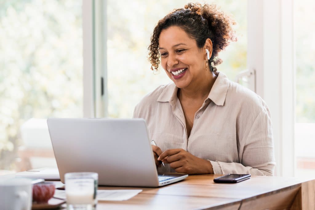 A woman works from home.