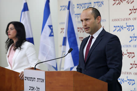 Israeli Education Minister Naftali Bennett (R) and Justice Minister Ayelet Shaked, from the Jewish Home party, deliver statements in Tel Aviv, Israel December 29, 2018. REUTERS/Corinna Kern
