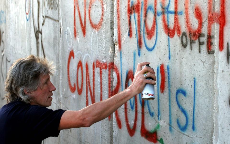 Roger Waters protesting at an Israeli separation barrier on the West Bank, in 2006 - AFP