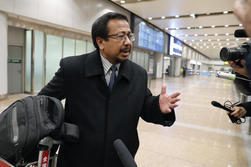 Malaysian Ambassador to North Korea Mohamad Nizan Mohamad speaks to journalists as he arrives at the Beijing Capital International Airport in Beijing, China, from Pyongyang after being recalled by Malaysian government, Tuesday, Feb. 21, 2017. Mohamad says at the airport while in transit to Malaysia the investigation into the death of the exiled half-brother of North Korea's ruler at Kuala Lumpur's international airport in Malaysia is being conducted in an impartial manner. Kim appeared to have been poisoned at Kuala Lumpur’s airport last week. (AP Photo/Andy Wong)