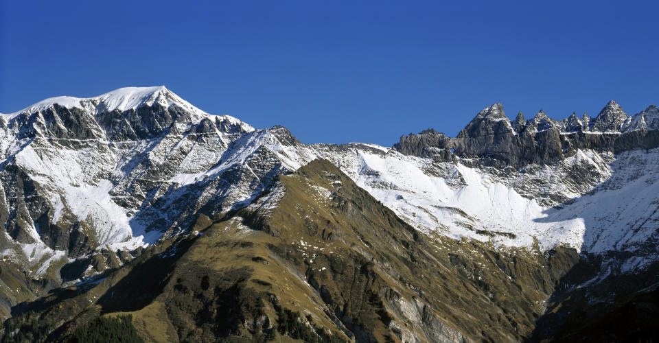 FILE - In this Oct. 10, 2005 photo Mount Piz Segnas, left, and the Tschingel Horn mountains, right, with the Martin's Hole near Elm in the canton of Glarus, are pictured in Switzerland. Police in southeastern Graubuenden canton (state) said a several-seater plane crashed Saturday on the Piz Segnas mountain above the Swiss Alpine resort of Flims, striking the mountain's western flank about 2,540 meters (8,330 feet) above sea level. There was no immediate word on casualties. (Gaetan Bally/Keystone via AP, file)