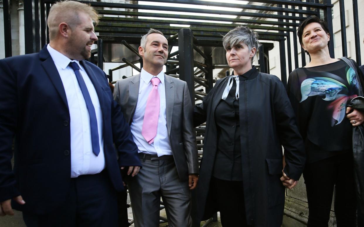 Civil partners Shannon Sickles (right) and Grainne Close and Christopher Patrick Flanagan (left) and Henry Edmond Kane leaving the High Court in Belfast - PA