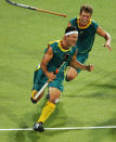 ATHENS - AUGUST 27: Jamie Dwyer #1 of Australia celebrates after scoring the winning goal in men's field hockey gold medal match against the Netherlands on August 27, 2004 during the Athens 2004 Summer Olympic Games at the Helliniko Olympic Complex Hockey Centre in Athens, Greece. (Photo by Stuart Franklin/Getty Images)