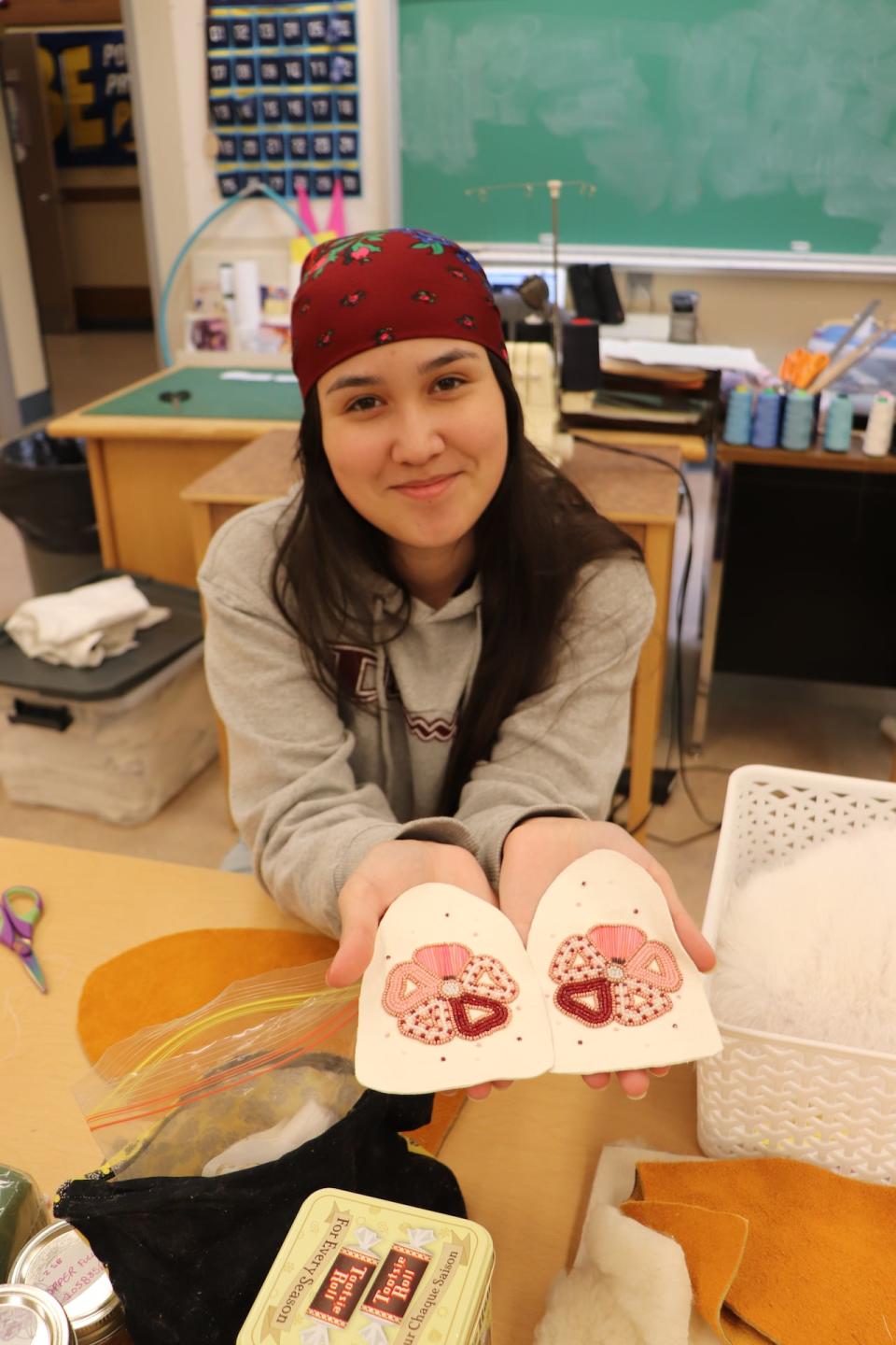 Leandra Blanchard making moccasins, as part of the Northern Cultural Expression Society’s Yukon First Nation Grad Regalia program in Whitehorse.