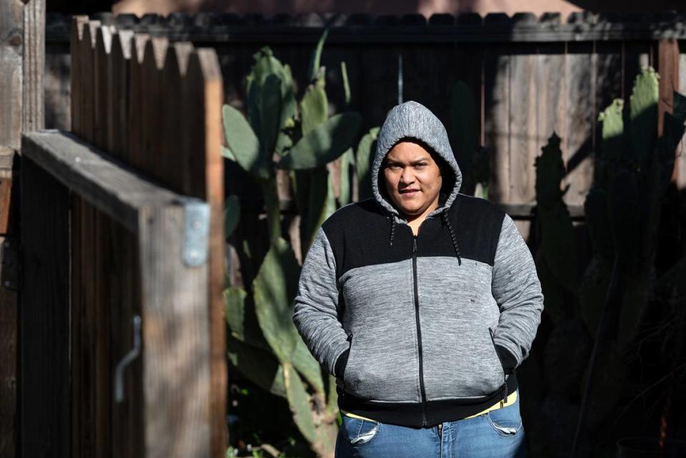 Monica Alvarado stands in her yard in Modesto on Feb. 15. She has a daughter with down syndrome and her whole family is on Medi-Cal. Each year she struggles with the uncertainty of knowing whether they will be eligible for renewal.