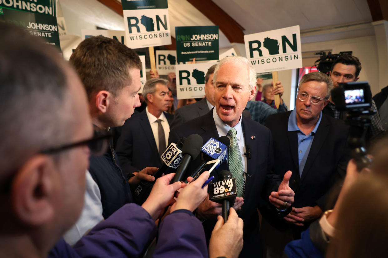 Sen. Ron Johnson speaks to reporters following a rally with supporters on Oct. 25, 2022 in Waukesha, Wisconsin.