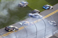 William Byron (24), Martin Truex Jr. (19), Kurt Busch (1), Austin Dillon (3), Ryan Newman (6) and Kevin Harvick (4) are involved in a multi-car accident along the front stretch after a restart from an earlier accident during the NASCAR Daytona Clash auto race at Daytona International Speedway, Sunday, Feb. 9, 2020, in Daytona Beach, Fla. (AP Photo/Phelan M. Ebenhack)