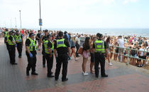 Police at Portobello Beach in Edinburgh where they broke up large crowds who flocked to the beach to make the most of the good weather.