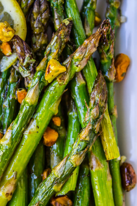 <p>The Food Charlatan</p><p>A few simple ingredients, but an unforgettable flavor with the combination of lemon, pistachios, and tarragon. Get this <a href="https://thefoodcharlatan.com/lemon-asparagus-with-pistachios/" rel="nofollow noopener" target="_blank" data-ylk="slk:Lemon Asparagus with Pistachios;elm:context_link;itc:0;sec:content-canvas" class="link ">Lemon Asparagus with Pistachios</a> recipe!</p><p><strong>Related: <a href="https://www.yahoo.com/lifestyle/45-easy-easter-desserts-try-211038459.html" data-ylk="slk:45+ Easy Easter Desserts & Recipes;elm:context_link;itc:0;sec:content-canvas;outcm:mb_qualified_link;_E:mb_qualified_link;ct:story;" class="link  yahoo-link">45+ Easy Easter Desserts & Recipes</a></strong></p>