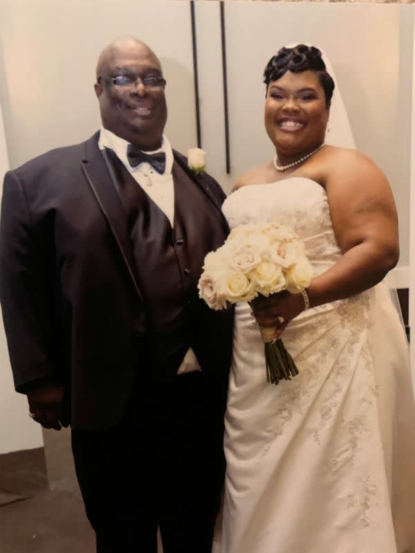 A handout image shows Devon Brumfield posing for a wedding photo with her father