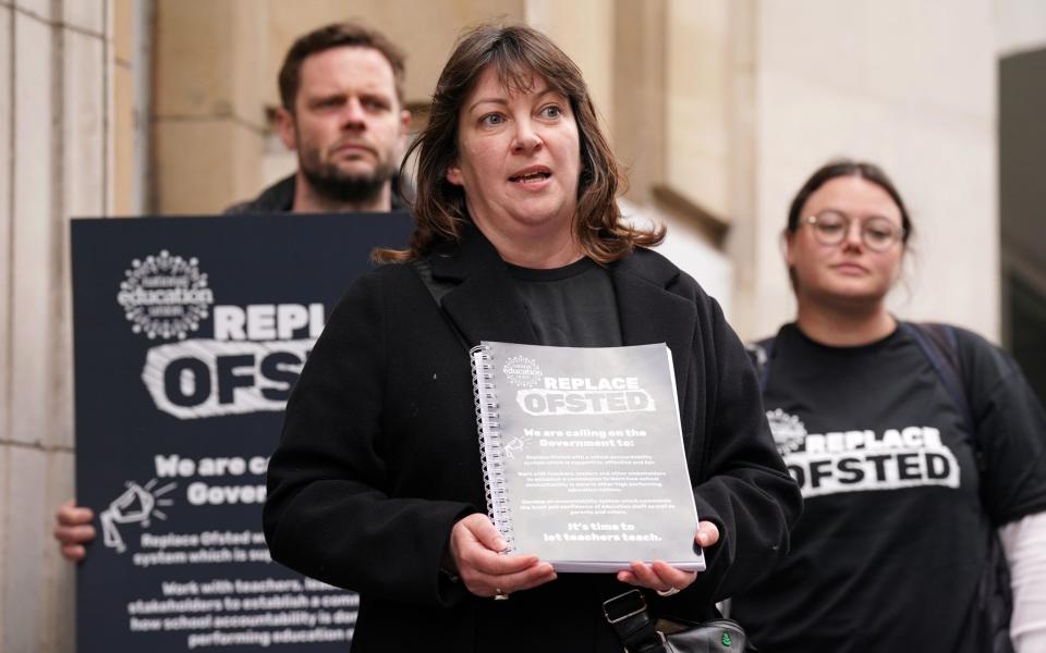 Niamh Sweeney, deputy general secretary of the National Education Union, protesting against Ofsted on Thursday - Kirsty O'Connor/PA