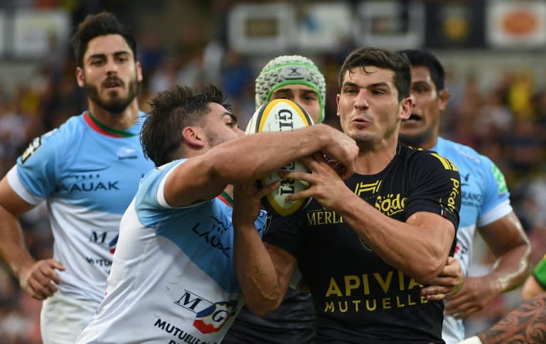La Rochelle's French centre Steeve Barry (R) vies for the ball with Bayonne's French centre Felix Le Bourhis (L) on September 24, 2016, at the Marcel Deflandre Stadium in La Rochelle, western France