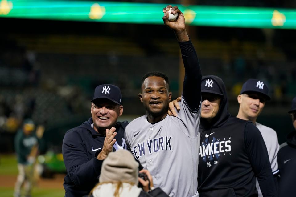 Yankees pitcher Domingo Germán celebrates after throwing a perfect game against the A's.