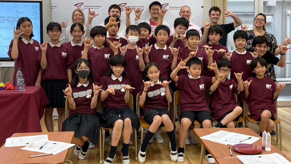 WT students Ava Sealy and Jacob Hurst and Dr. Naruki Hiranuma, associate professor of environmental science, all three standing center, traveled to several Japanese cities to teach elementary students in four schools the basics of climate science.