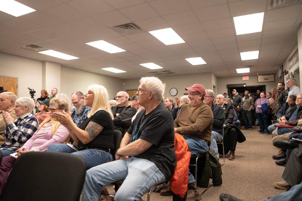 Attendees react to public comments during a special meeting regarding the Marshall mega site in Marshall Township on Thursday, Jan. 26, 2023.