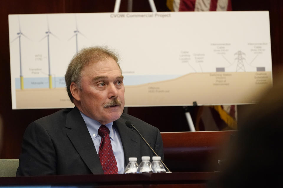 Mark Mitchell, Senior vice president for project construction for Dominion Energy testifies for during a hearing at the State Corporations Commission Tuesday May 17, 2022, in Richmond, Va. The commission was reviewing an application for Dominion's offshore wind project. (AP Photo/Steve Helber)