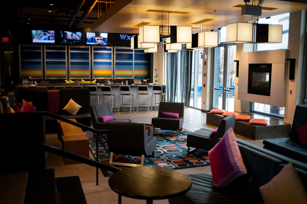 An empty lobby at the Aloft Dulles Airport North Hotel in Ashburn, Va., on March 24, 2020.