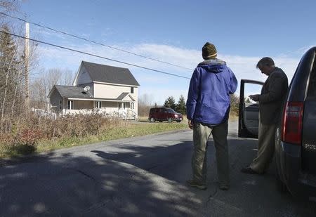 Members of the media wait outside the home of Theodore Wilbur, boyfriend of Kaci Hickox, the nurse who was released from New Jersey's mandatory quarantine for certain travelers from Ebola-stricken West Africa, in Fort Kent, Maine, October 28, 2014. REUTERS/Joel Page