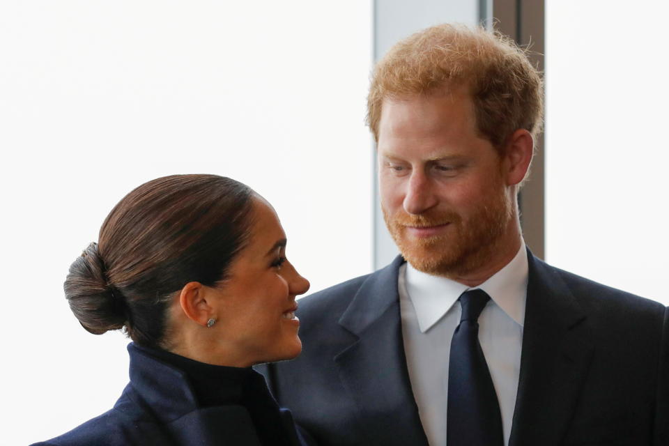 Britain's Prince Harry and Meghan, Duke and Duchess of Sussex, look at each other during a visit to One World Trade Center in Manhattan, New York City, U.S., September 23, 2021. REUTERS/Andrew Kelly