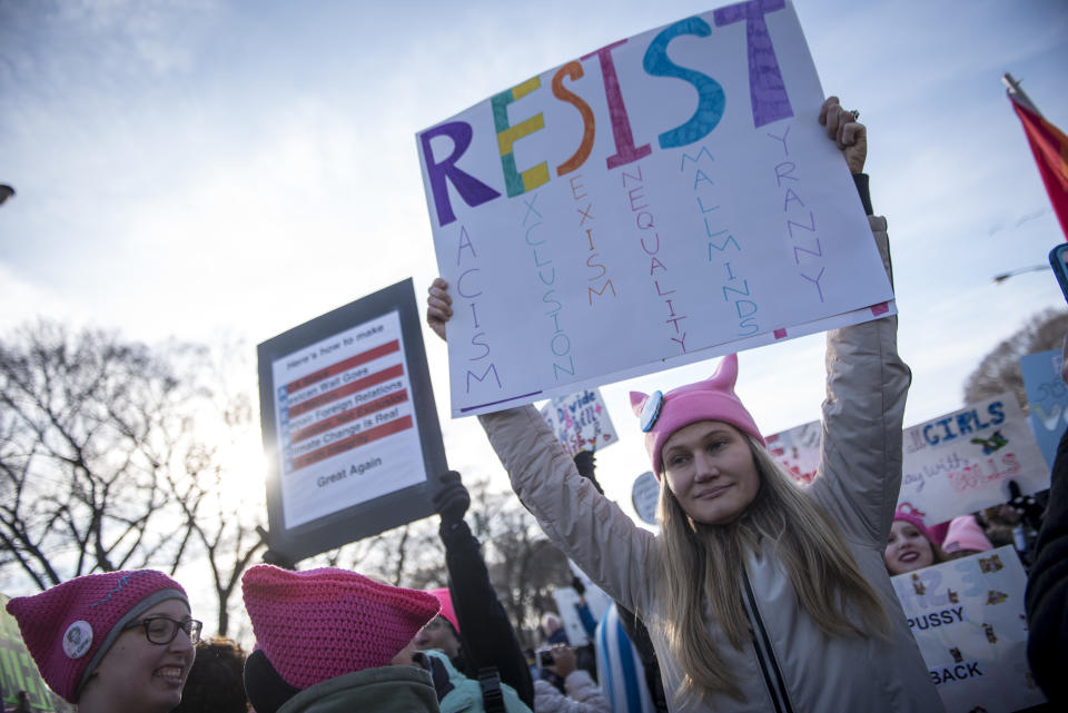 <p>Demonstrators hold signs during the second annual Women’s March in Chicago, IIl., on Saturday, Jan. 20, 2018. (Photo: Christopher Dilts/Bloomberg via Getty Images) </p>