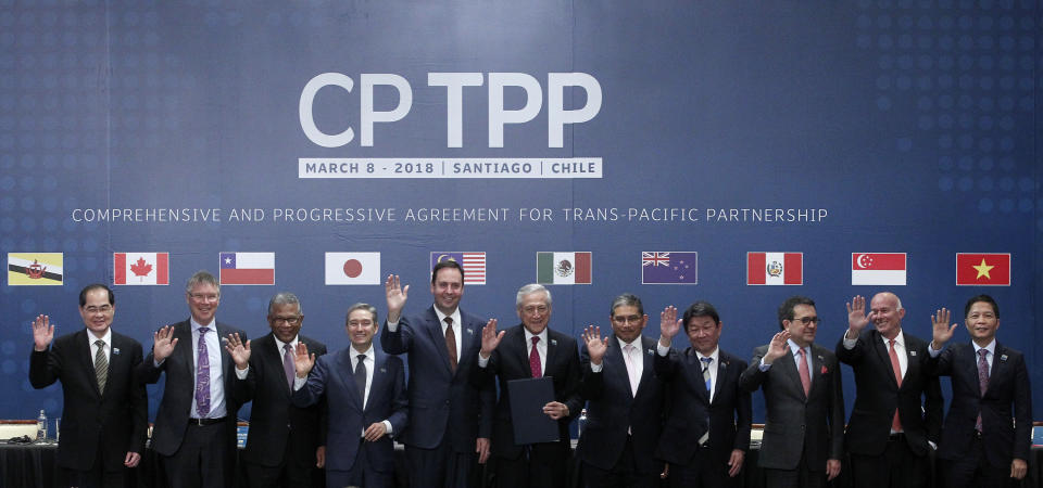 (L-R) Singapore's Minister for Trade and Industry Lim Hng Kiang, New Zealand's Minister for Trade and Export Growth David Parker, Malaysia's Minister for Trade and Industry Datuk J. Jayasiri, Canada's International Trade Minister Francois-Phillippe Champagne, Australia's Trade Minister Steven Ciobo, Chile's Foreign Minister Heraldo Munoz, Brunei's Acting Minister for Foreign Affairs Erywan Dato Pehin, Japan's Minister of Economic Revitalization Toshimitsu Motegi, Mexico's Secretary of Economy Ildefonso Guajardo Villarreal, Peru's Minister of Foreign Trade and Tourism Eduardo Ferreyros Kuppers and Vietnam's Industry and Trade Minister Tran Tuan Anh pose for an official picture after signing the rebranded 11-nation Pacific trade pact Comprehensive and Progressive Agreement for Trans-Pacific Partnership (CPTPP) in Santiago, on March 8, 2018.
A slimmed-down trade pact signed on Thursday will allow eleven Asia-Pacific nations to push forward with economic integration in the face of greater US protectionism, even if the new deal will offer less benefits than originally hoped. / AFP PHOTO / CLAUDIO REYES        (Photo credit should read CLAUDIO REYES/AFP/Getty Images)