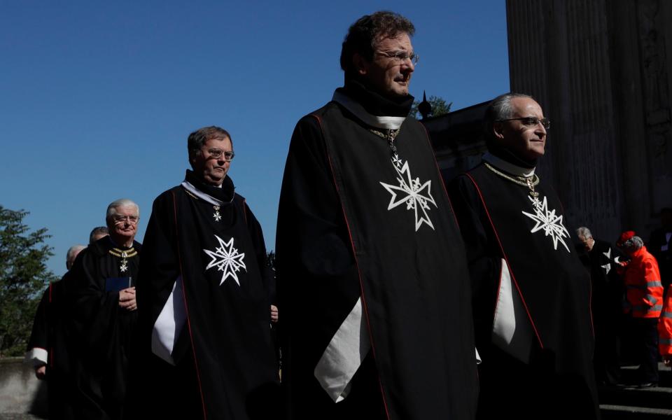 Albrecht von Boeselager, second from right, walks in procession along with other Knights of Malta before the election of the new Grand Master - Credit:  Alessandra Tarantino/AP