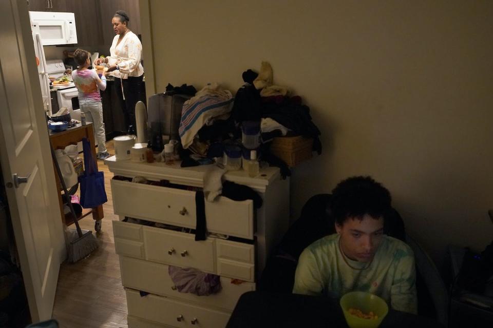 There is no returning to pre-pandemic realities of tech in the home. A mother and children seen at their home in Chicago on Oct. 12, 2022. (AP Photo/Charles Rex Arbogast)