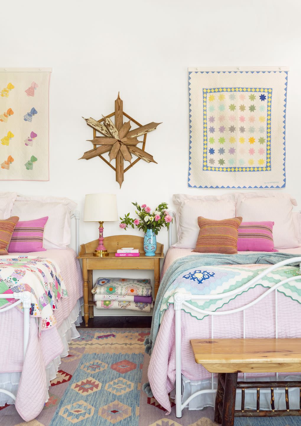 twin beds bedroom with vintage quilts