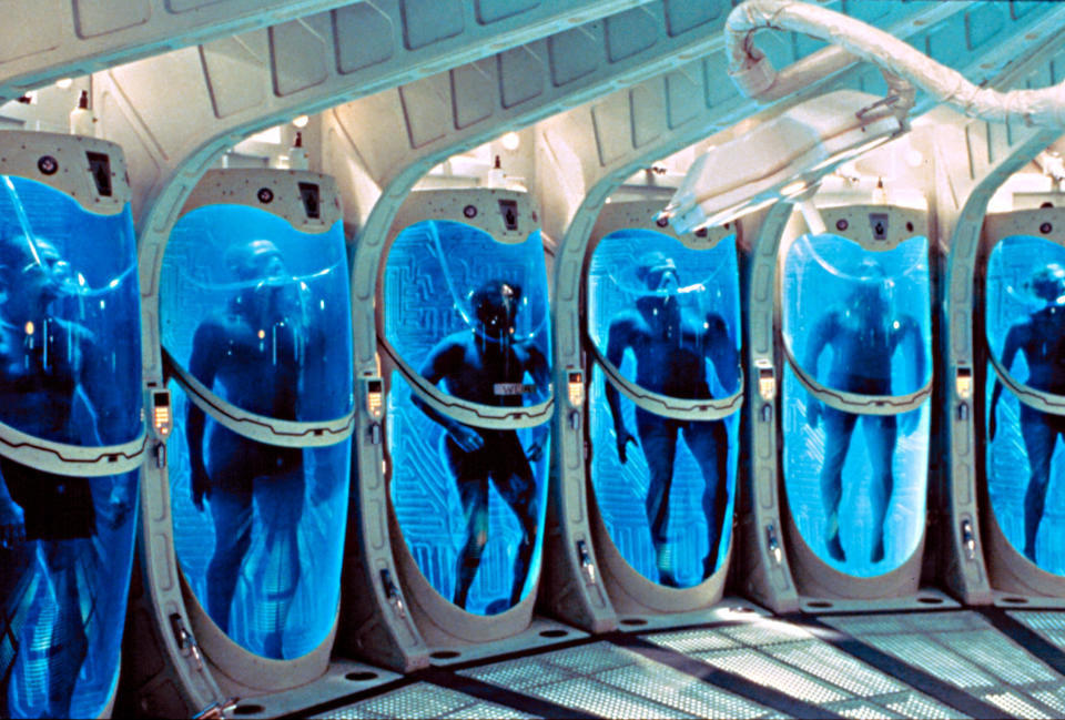 astronauts in sleep chambers