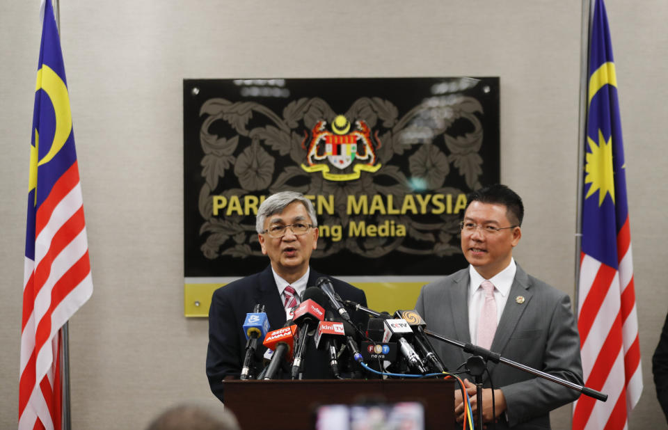 Malaysia parliament lower house speaker Mohamad Ariff Md Yusof, left, and deputy speaker Nga Kor Ming speaks to media after a vote on motions to appoint a new speaker during a parliament session in Kuala Lumpur, Malaysia, Monday, July 13, 2020. Malaysian new Prime Minister Muhyiddin Yassin narrowly won a motion to boot the parliament speaker Monday, scraping through the first test of his support nearly five months after he took power. (AP Photo/Vincent Thian)