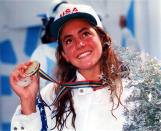 USA's Summer Sanders, smiles for a winner's portrait after taking the gold medal in the women's 200m butterfly Friday, July 31, 1992 in the Barcelona Olympics. (AP Photo/POOL/IOPP-Yannis Behrakis)