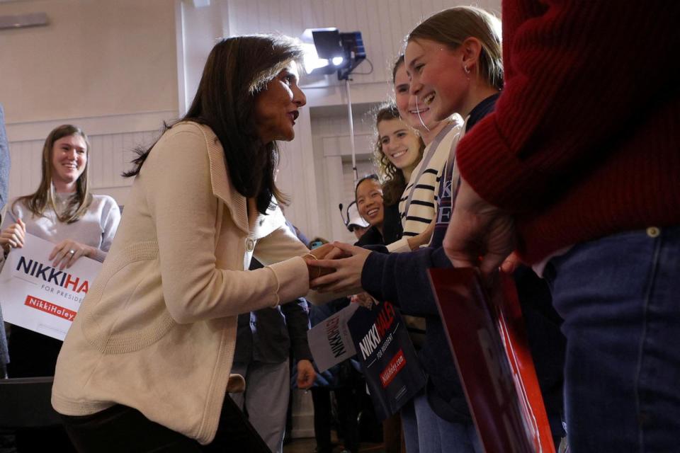 PHOTO: Republican presidential candidate and former Ambassador to the United Nations Nikki Haley greets young women in the audience as she takes the stage for a campaign town hall in Rye, N.H., Jan. 2, 2024.    (Brian Snyder/Reuters)