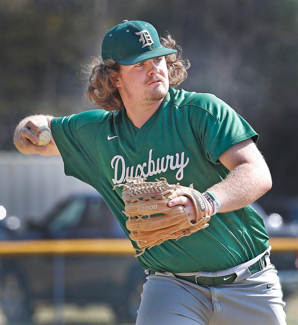 Dragons third baseman Nick Ayres who is hot slugging early in the season makes a play on a grounder to third.Duxbury hosted Silver Lake High in baseball  on Friday April 14, 2023 