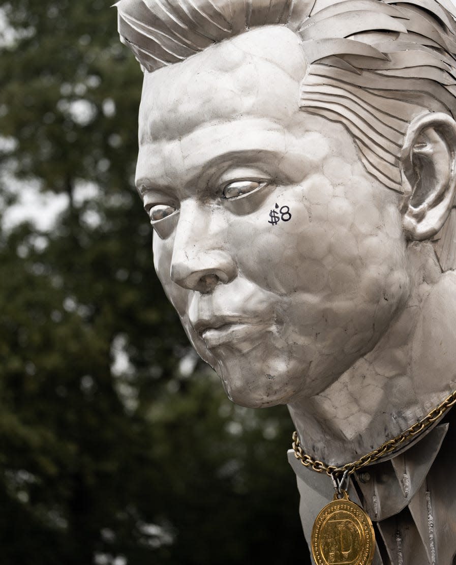 Elon Musk fans brought the Elon GOAT Token Monument — which features an "$8" symbol near its eye, a comment on the changes to Twitter verification — to a South Austin Costco parking lot in November.