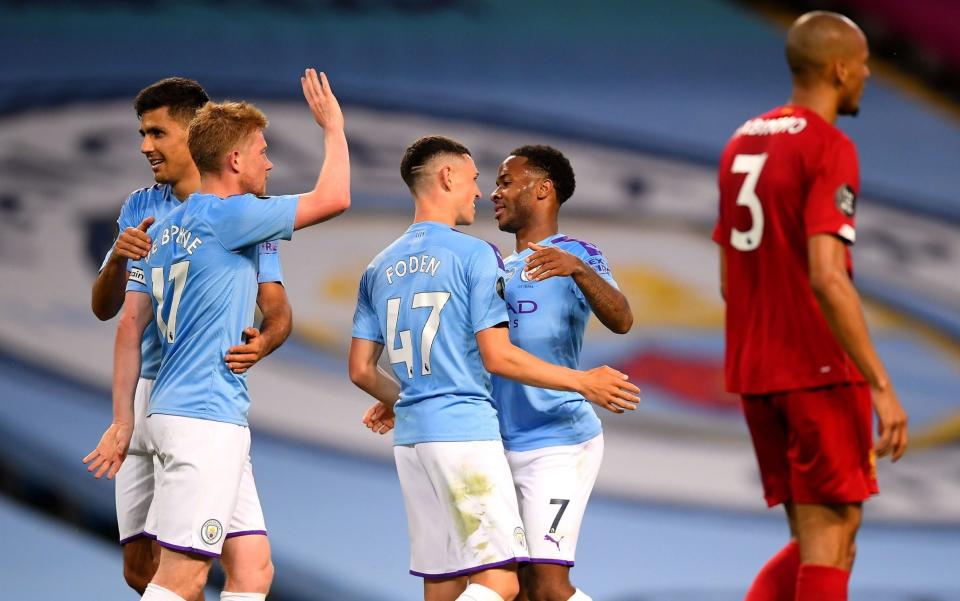 Manchester City celebrate as Liverpool are put to the sword - PA