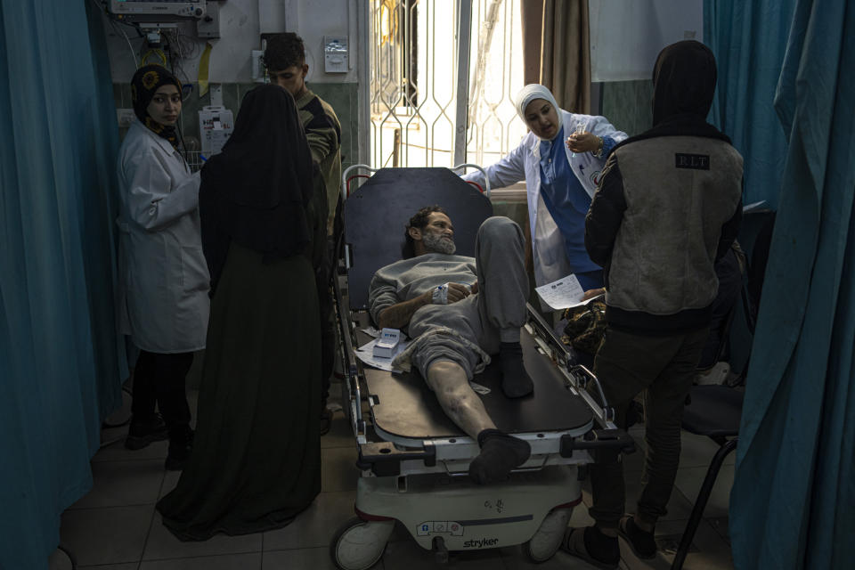 Palestinians who were arrested by the Israeli military in the north of the Gaza Strip and released through the Kerem Shalom crossing in the south wait for treatment in Rafah on Sunday, Dec. 24, 2023. (AP Photo/Fatima Shbair)
