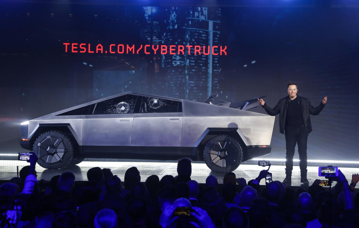 Tesla CEO Elon Musk introduces the Cybertruck at Tesla's design studio Thursday, Nov. 21, 2019, in Hawthorne, Calif. Musk is taking on the workhorse heavy pickup truck market with his latest electric vehicle. (AP Photo/Ringo H.W. Chiu)