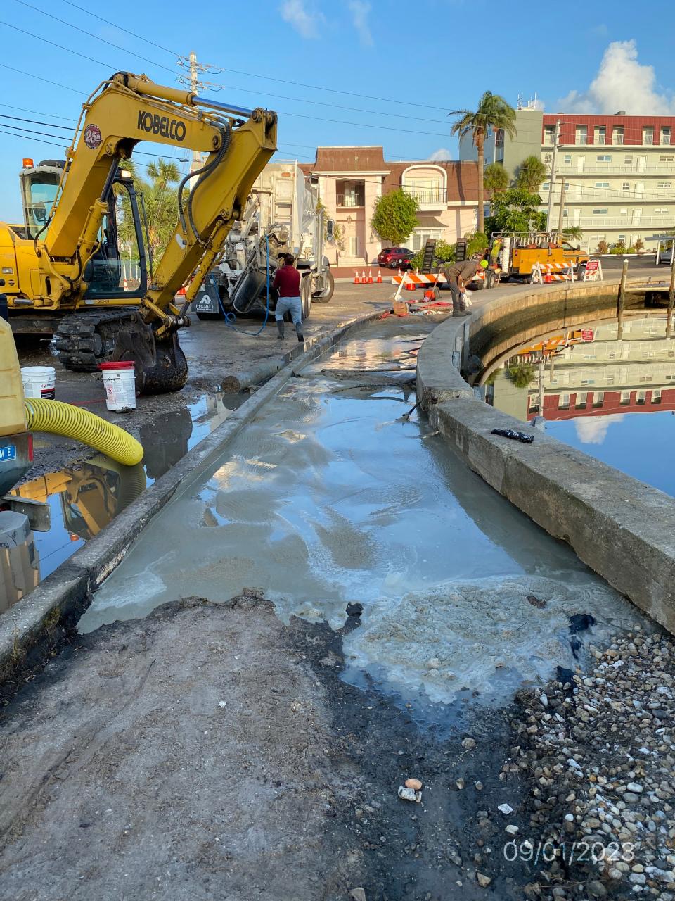 Road crews work to shore up Tarpon Center Drive in the city of Venice, with the goal of restoring one lane of traffic flow Friday afternoon.