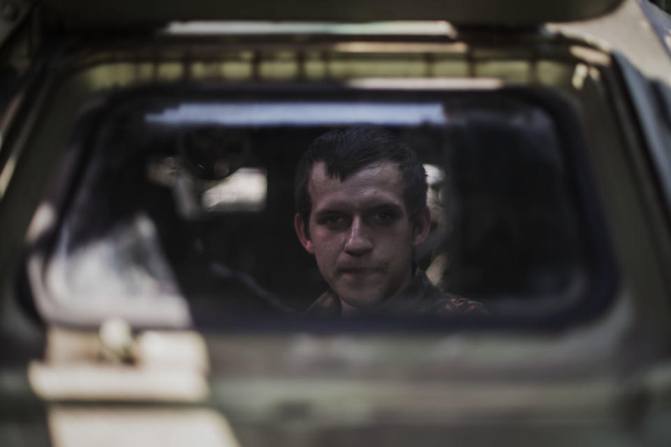 A pro Russia militia man is seen inside an APC placed today in front of the occupied administration building in Donetsk, Ukraine, Saturday, May 10, 2014. Two restive regions in eastern Ukraine are preparing to vote on declaring sovereignty and ceding from Ukraine, in a referendum on Sunday in the Donetsk and Luhansk regions, where pro-Russia insurgents have seized government buildings and clashed with police and Ukrainian troops.(AP Photo/Manu Brabo) 2014. (AP Photo/Manu Brabo)