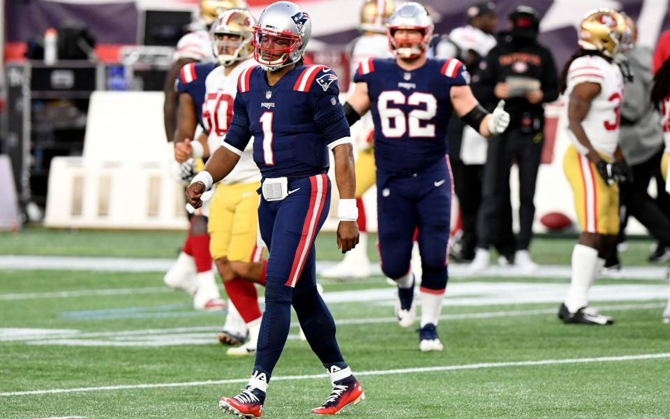 New England Patriots quarterback Cam Newton (1) walks off of the field after throwing an intercepting against the San Francisco 49ers during the first half at Gillette Stadium.  - Brian Fluharty-USA TODAY Sports