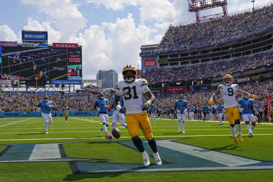 Green Bay Packers' Emanuel Wilson celebrates his touchdown during the second half of an NFL football game against the Tennessee Titans Sunday, Sept. 22, 2024, in Nashville, Tenn. (AP Photo/George Walker IV)