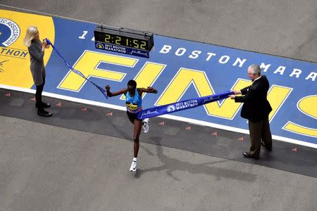 Apr 17, 2017; Boston, MA, USA; Edna Kiplagat crosses the finish line of the 2017 Boston Marathon winning the women's division. Brian Fluharty-USA TODAY Sports