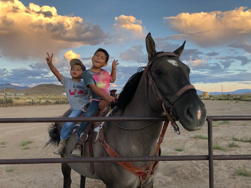 Shalene Mike-Collins' sons Bentlee and Talon pose for a photo on the reservation of the Duckwater Shoshone Tribe.